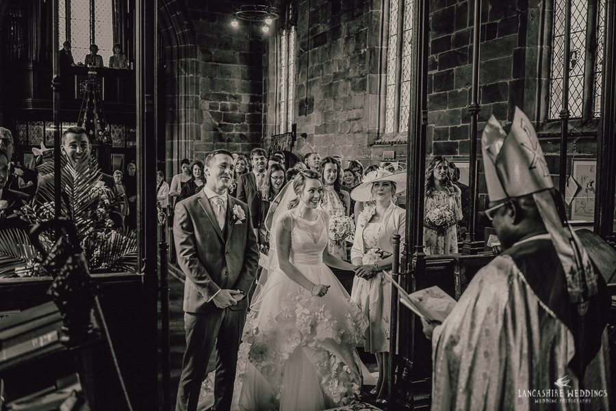 Gawsworth Church Bride and Groom laughing at the altar