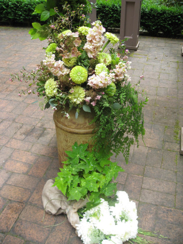vintage milk can with draping ferns, zinnia and stock flowers