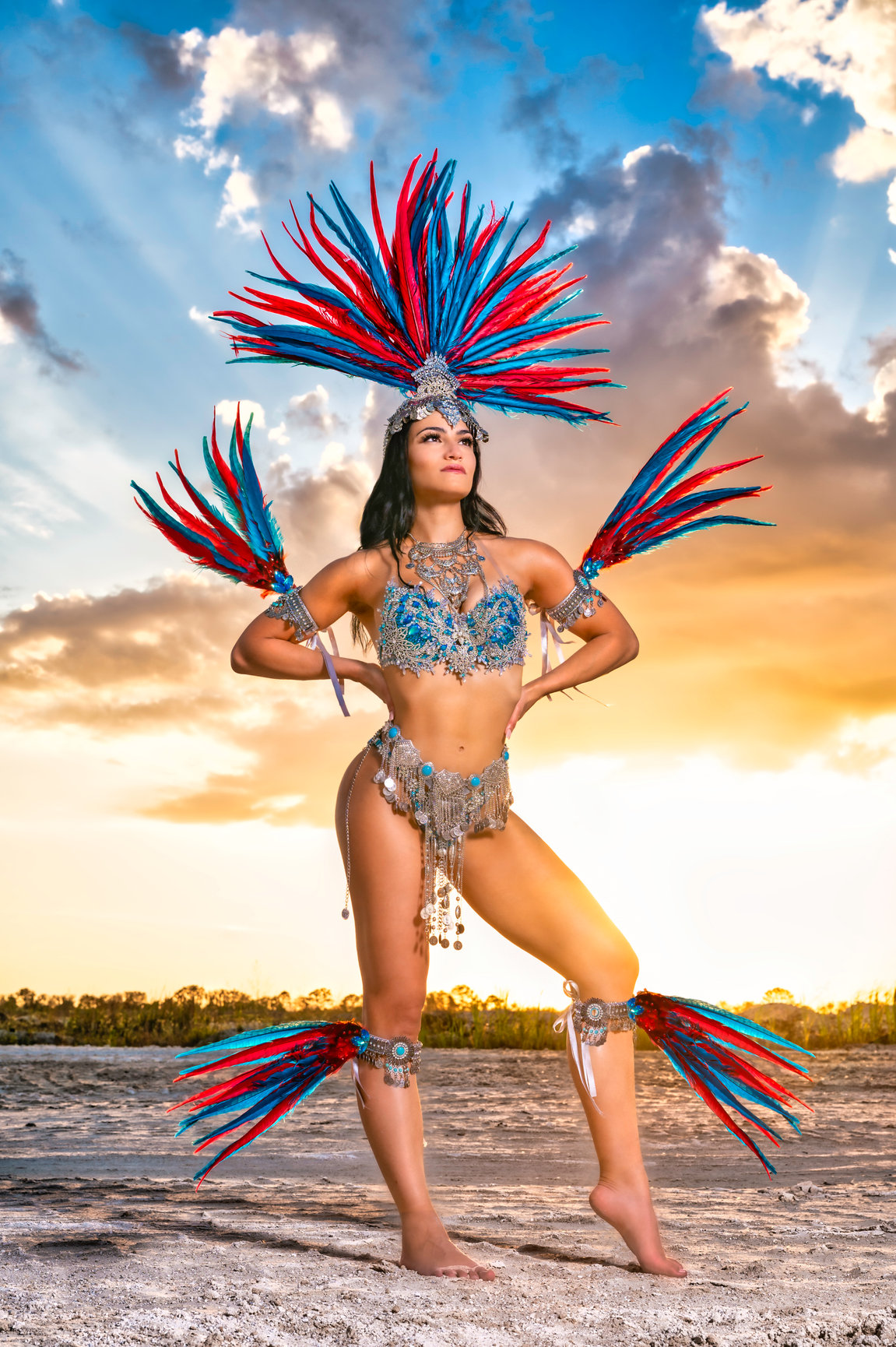 Fashion Photography: WBFF Pro Nicole Marrero Posing during a photo session in her theme wear outfit with feathers by Jessica McKnight Photography