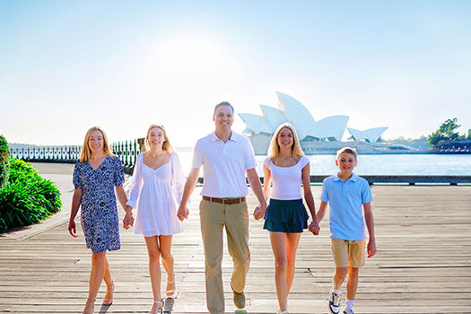 Portrait of a family walking near the harbour in a Sydney Opera House Photoshoot with Sarah Iris Photography.