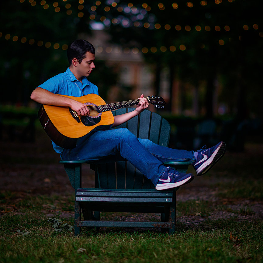 Senior portrait at Spring Creek Park creek bank East Texas by Swartz Portraits