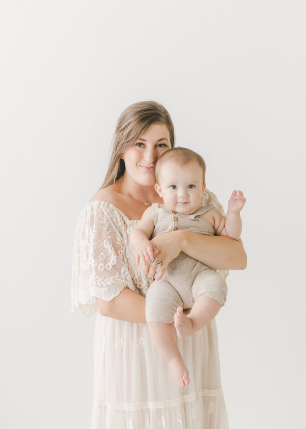 Mom holding baby in Minneapolis studio setting