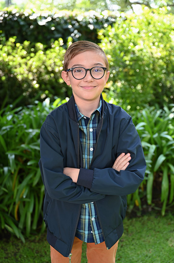teen standing on his backyard