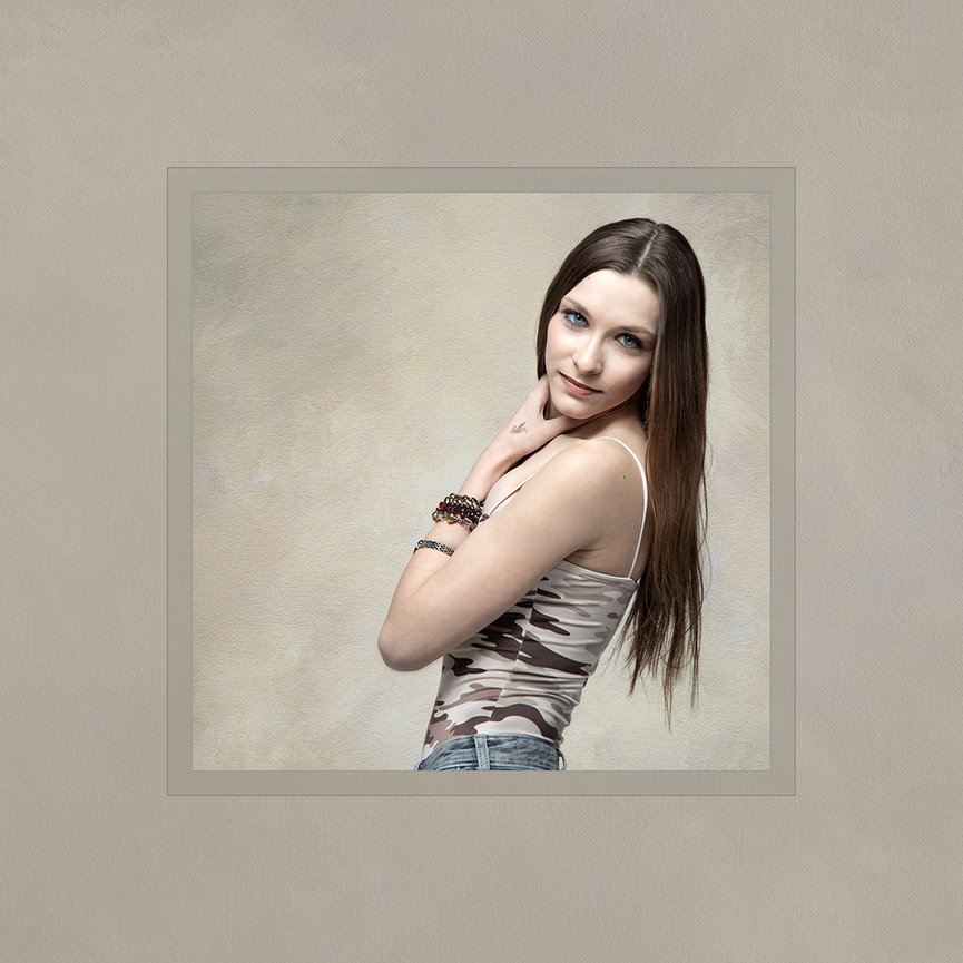 Fine art printed portrait of a young woman with a soft, painterly background, presented as a refined wall art piece with a timeless, elegant style.