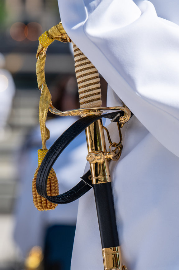 Close up of a sword on the Navy Service Dress White Uniform