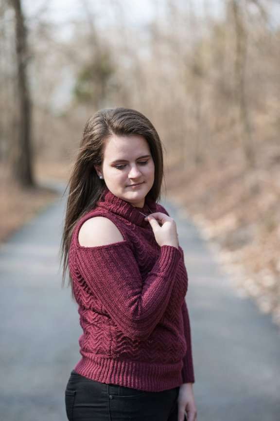 senior girl standing on trail for photos at Dogwood Canyon