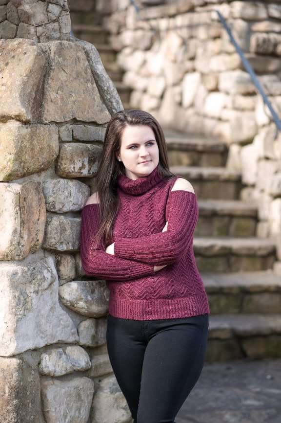 senior girl standing at stone wall in Dogwood Canyon Branson Missouri