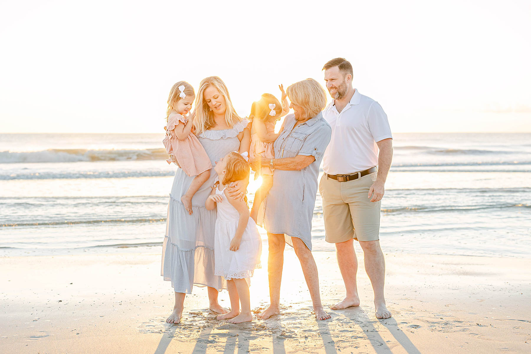 extended family standing together on ponte vedra beach at sunrise