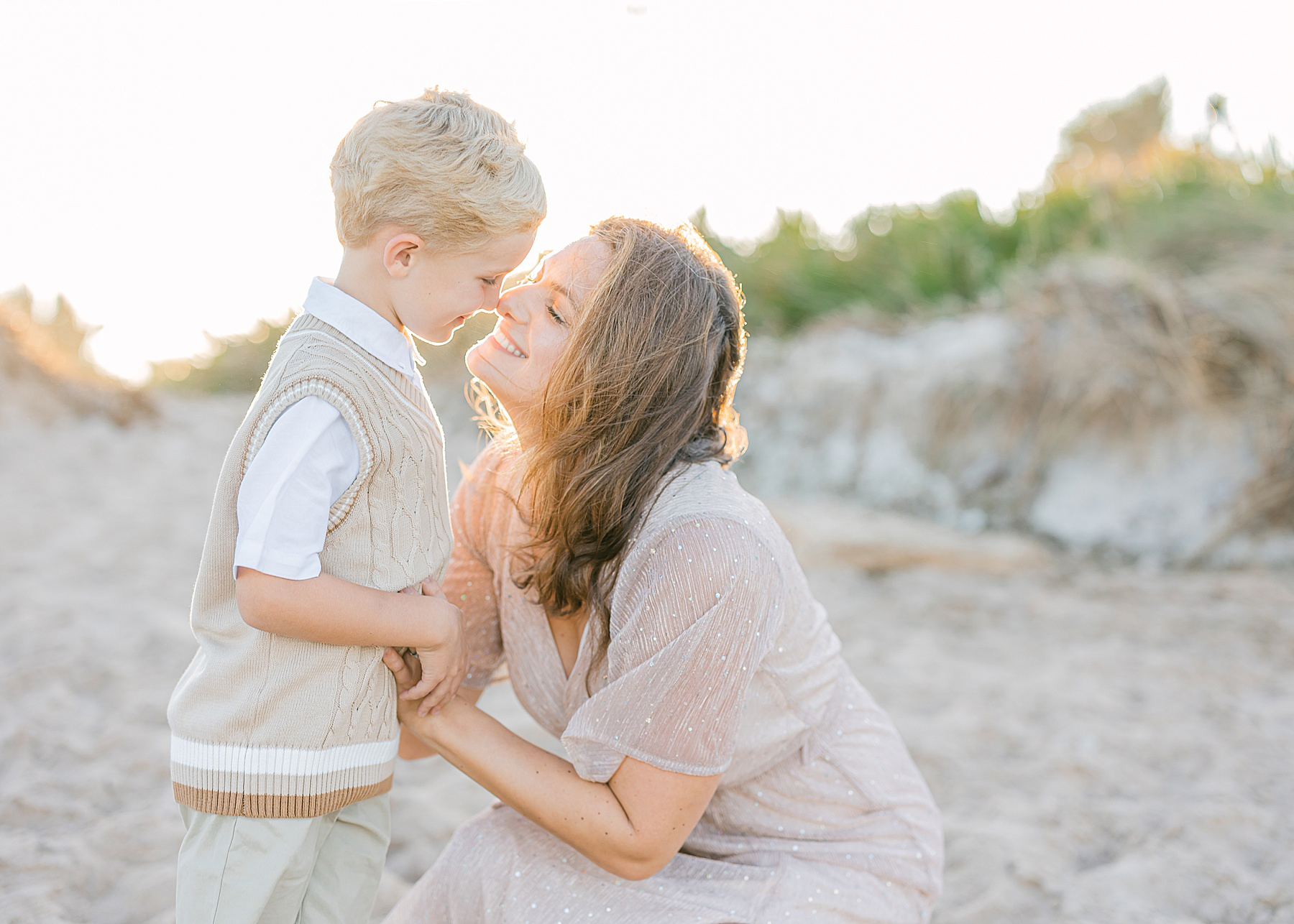 a light filled airy sunset beach portrait in saint augustine beach florida of a mother and son