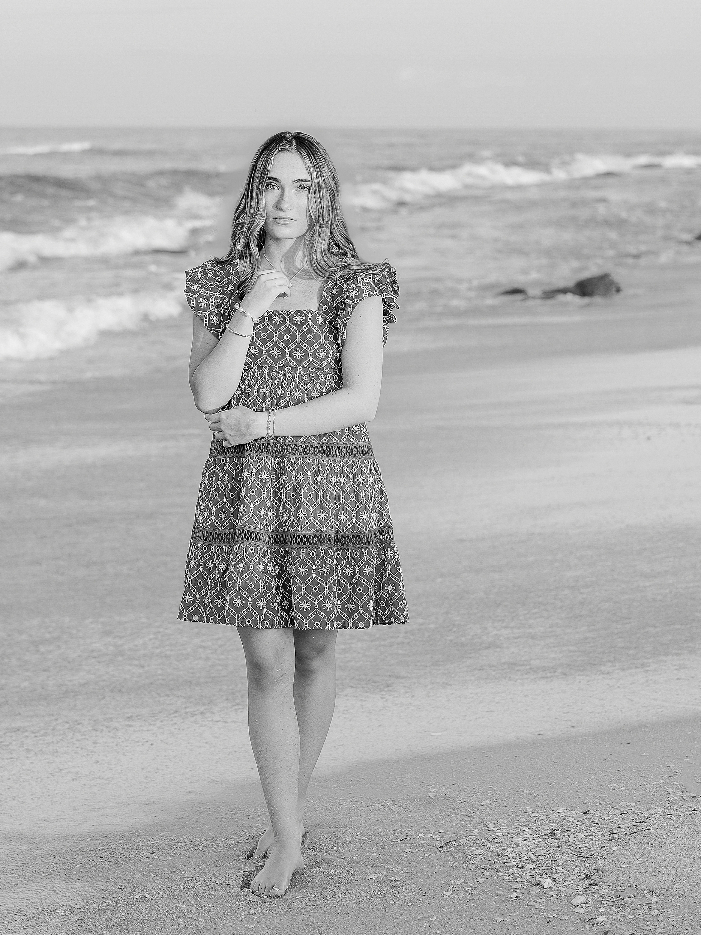 Black and white portrait of St. Johns County graduate at the beach.