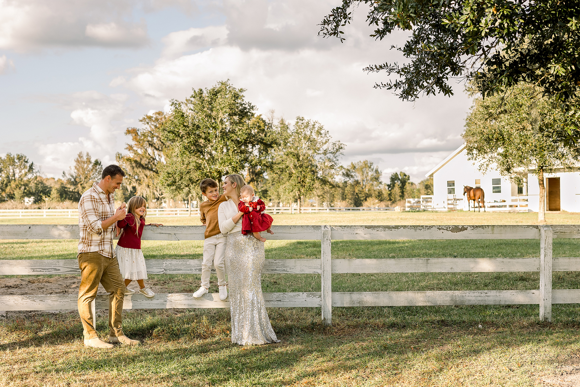 The Lochte family standing at the horse paddocks on Congaree and Penn farm.