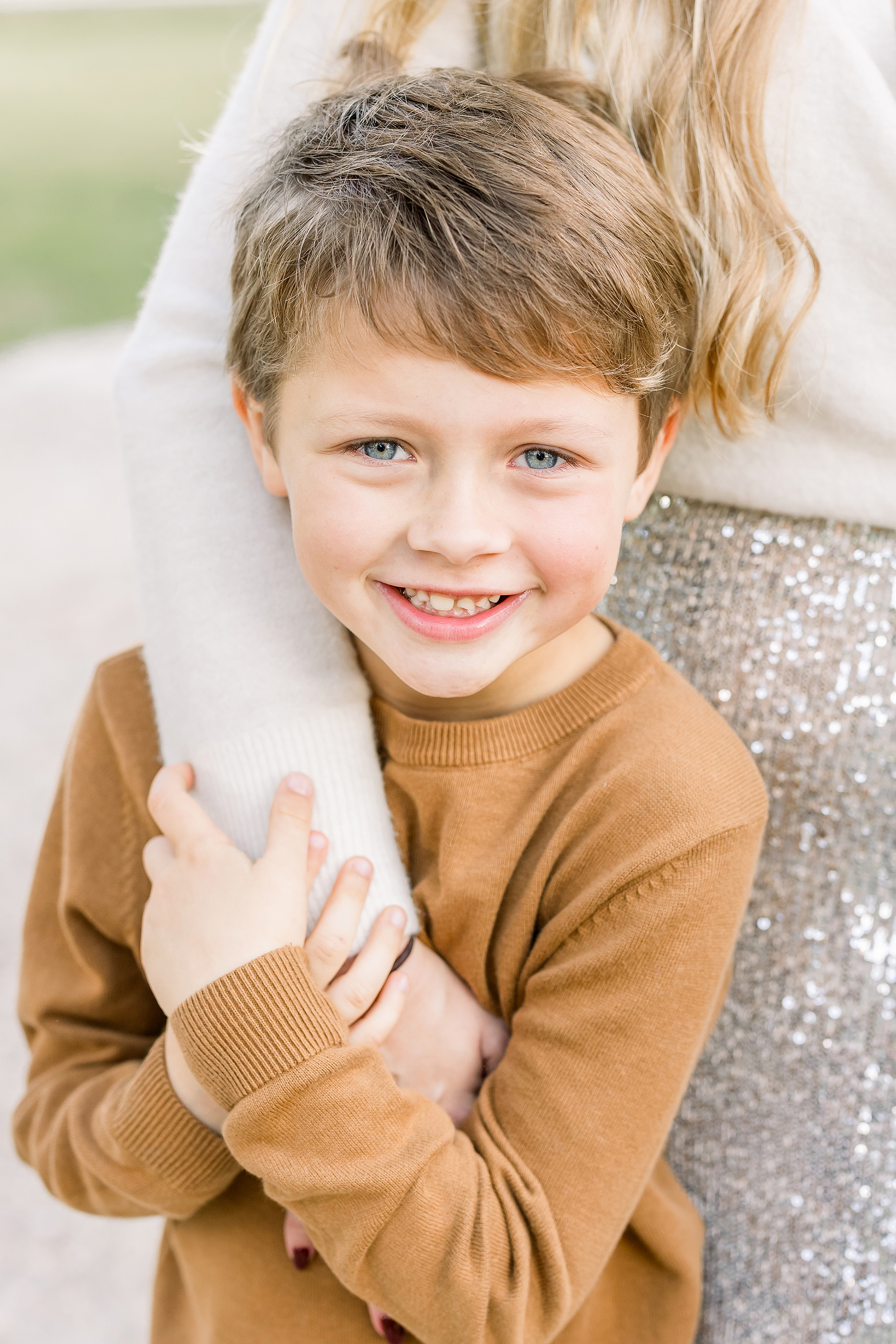 Fall neutral portrait of a little boy in a camel colored sweater.