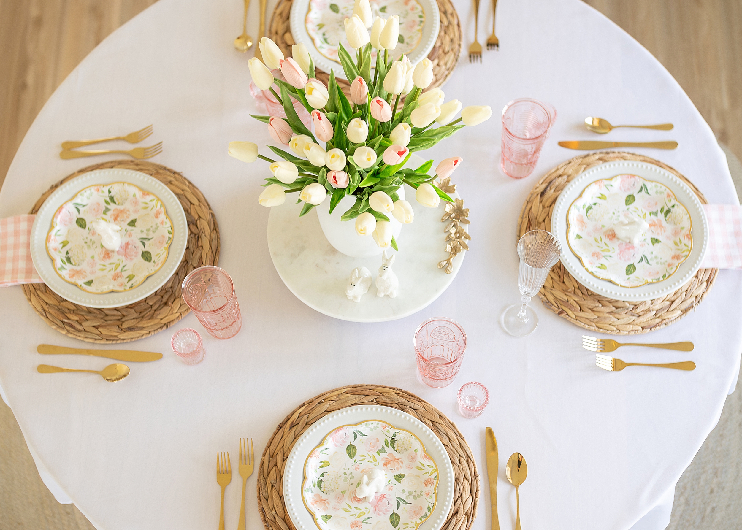 A pastel pink and white table set for Easter.