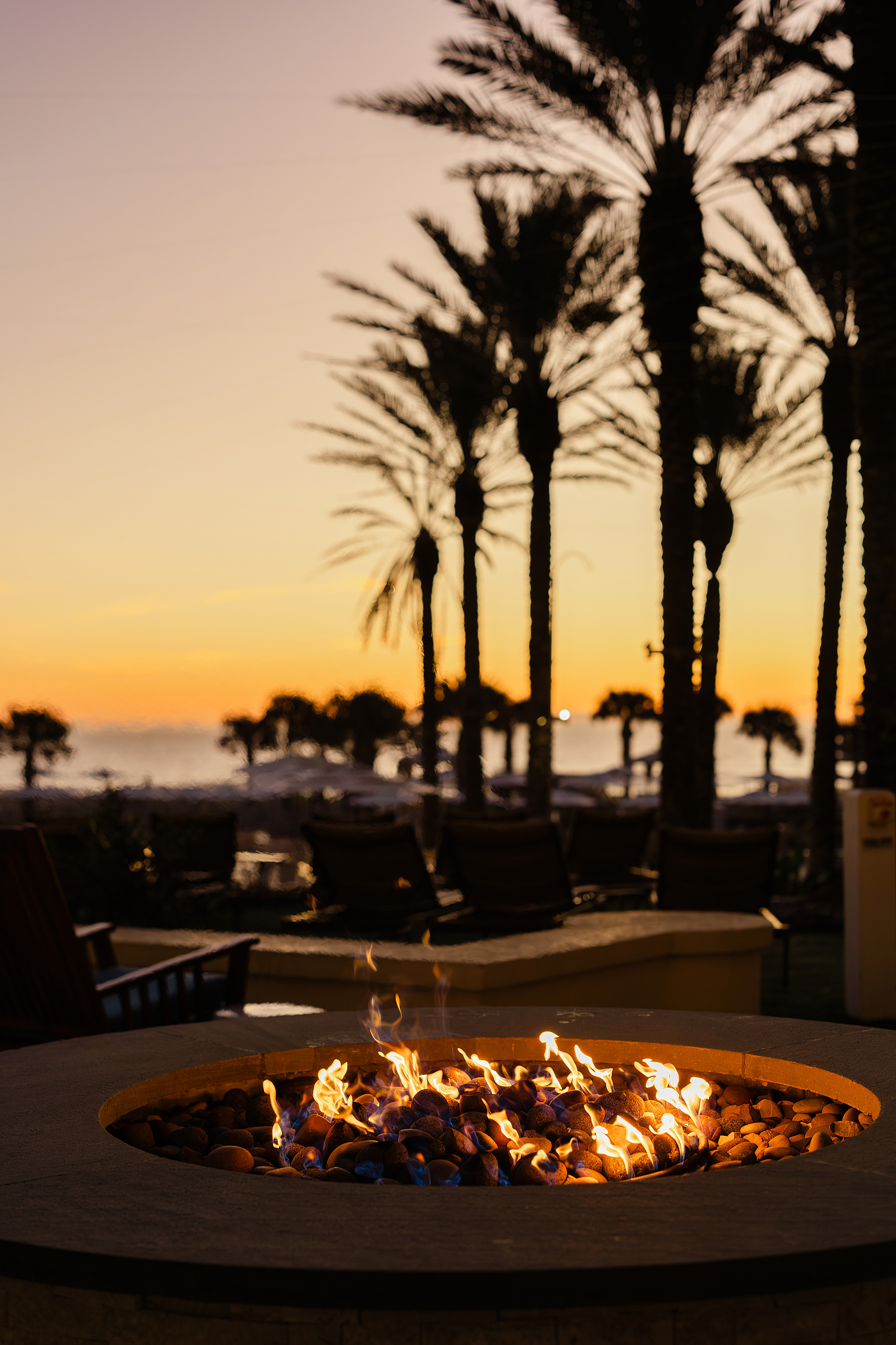 A colorful sunrise photo of the firepit at the Omni Resort on Amelia Island.