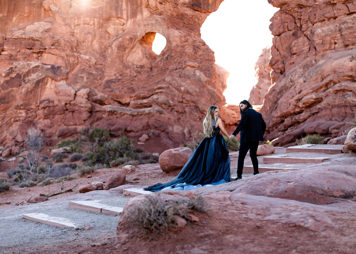 Couple walking in a rock arch setting