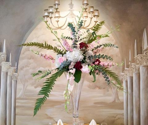 Ornate floral arrangement with chandelier