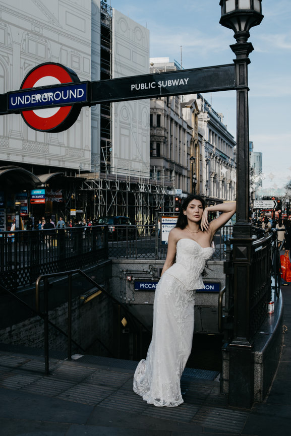 High-fashion bridal portrait at a London tube station; an unconventional and editorial take on city wedding photography.