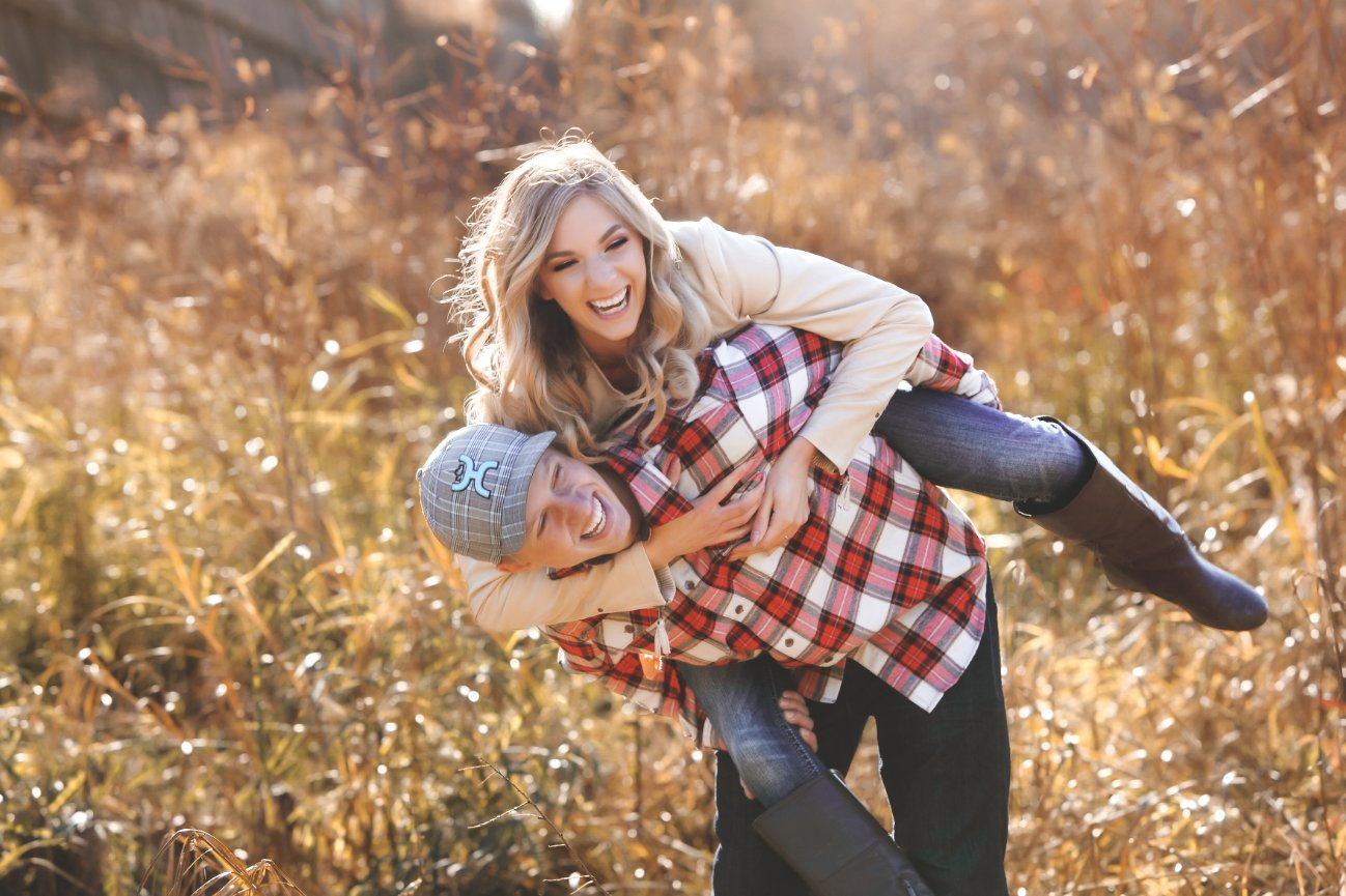couple having fun in a field