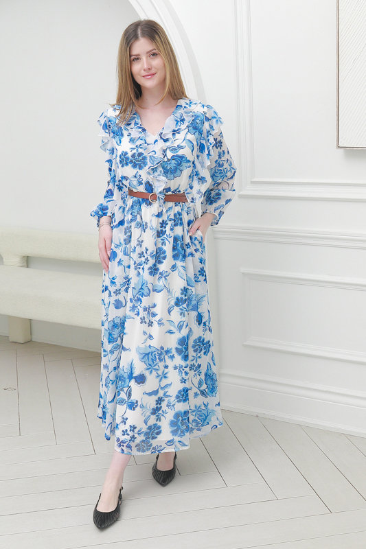 Model wearing blue floral midi dress photographed for Spring Summer 2026 fashion lookbook.