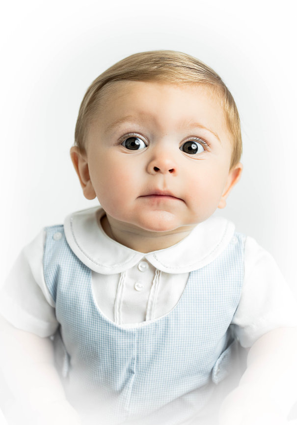 Heirloom baby photo showcasing timeless style and soft studio lighting