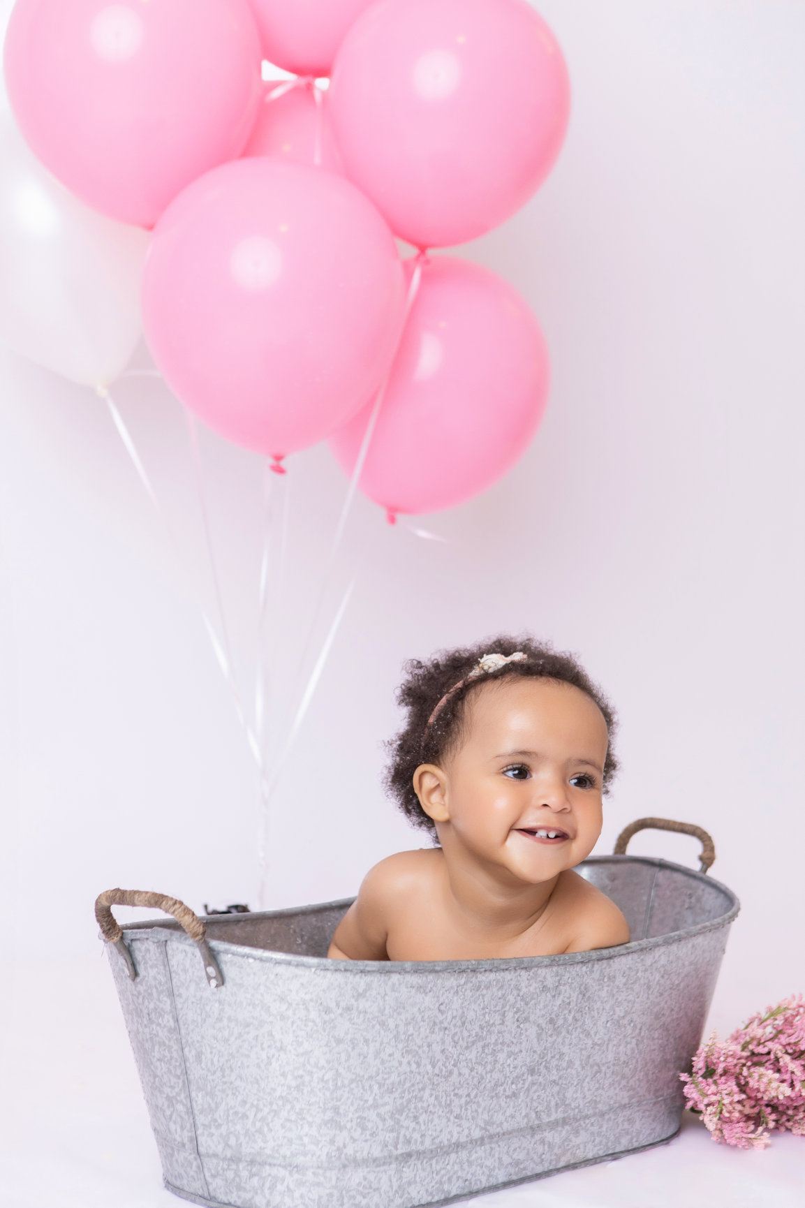 Calgary cake smash photography pink balloons tulle and bubbles first birthday session photo 24