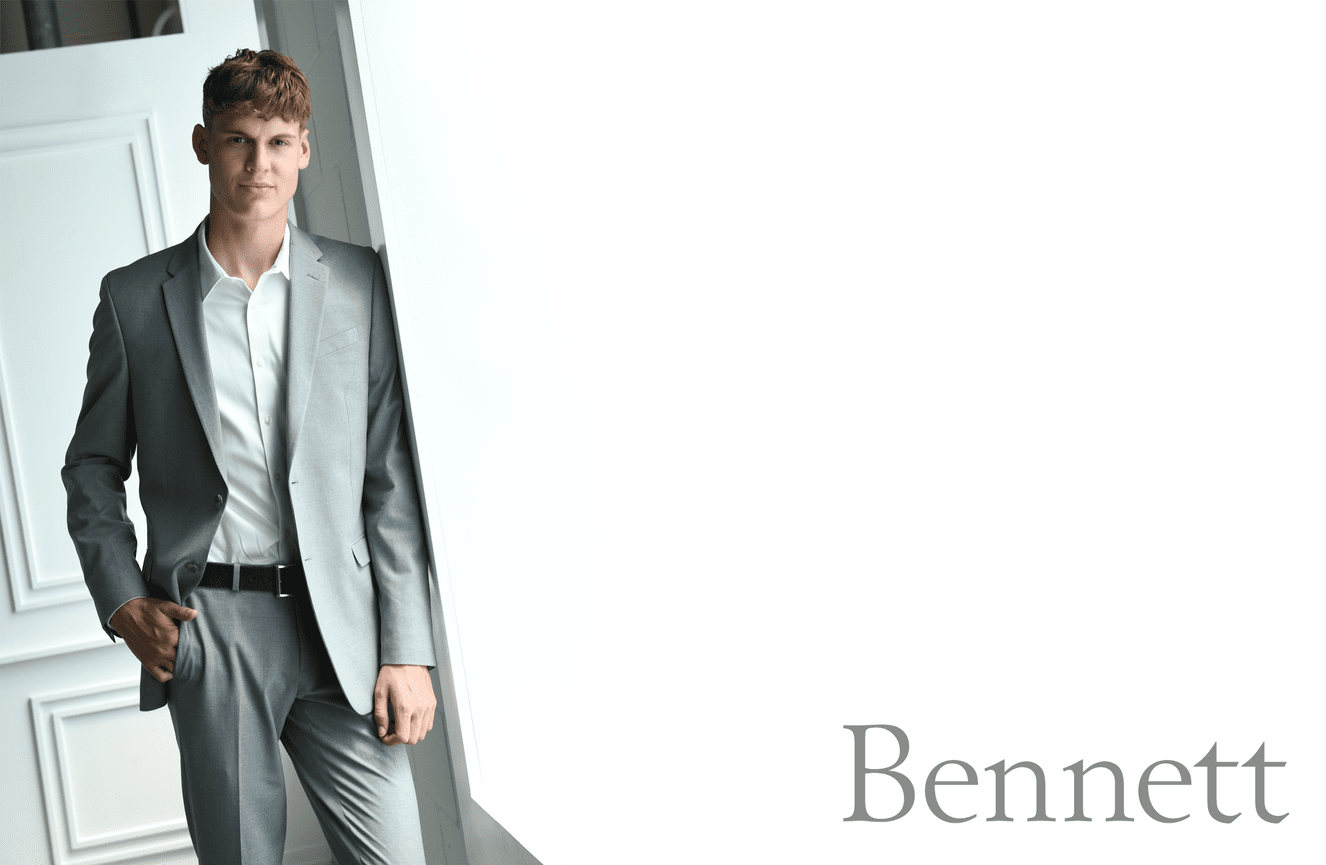 Bennett poses in a sharp gray suit for his high school senior photos at Kliks Photography in Cedar Rapids, Iowa.