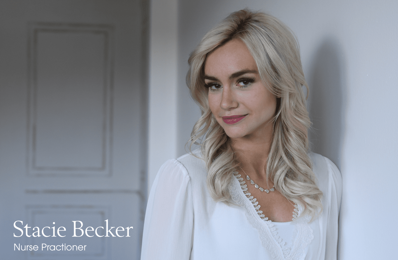 Stacie, a hospital nurse practitioner, poses for a headshot for her staff bio page.