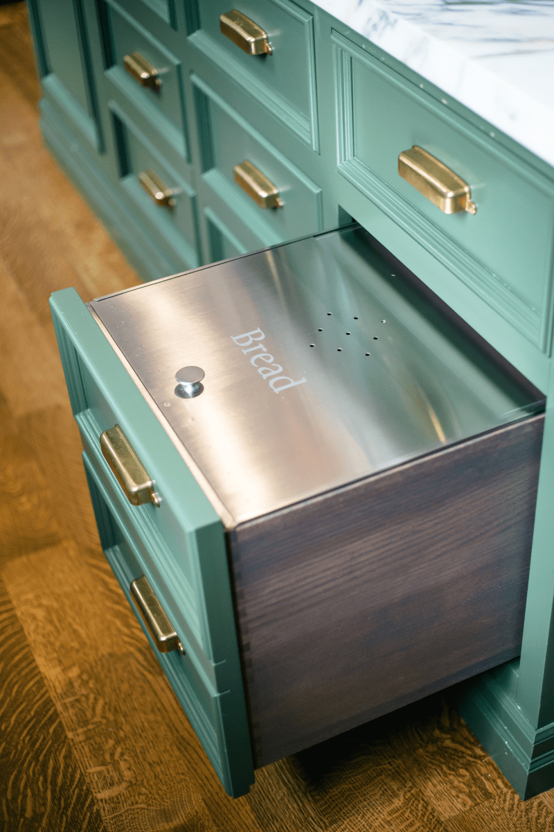 Organize your kitchen with a towel drawer under a stainless steel