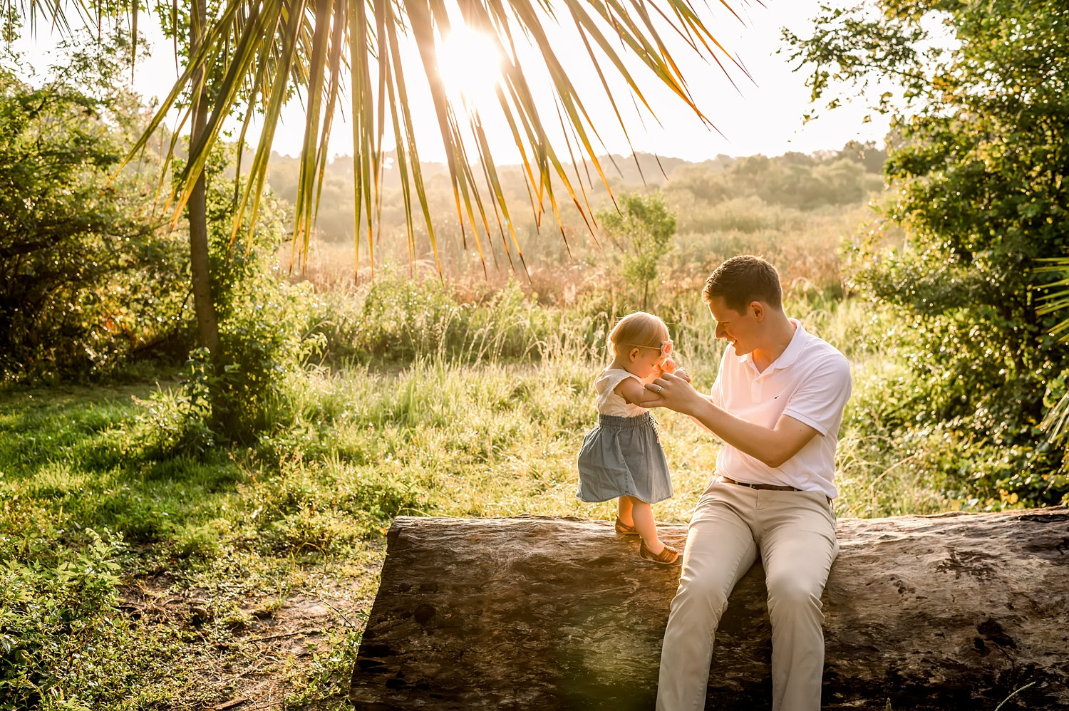 baby girl with father sitting on a log, Gainesville baby photographer, Rya Duncklee