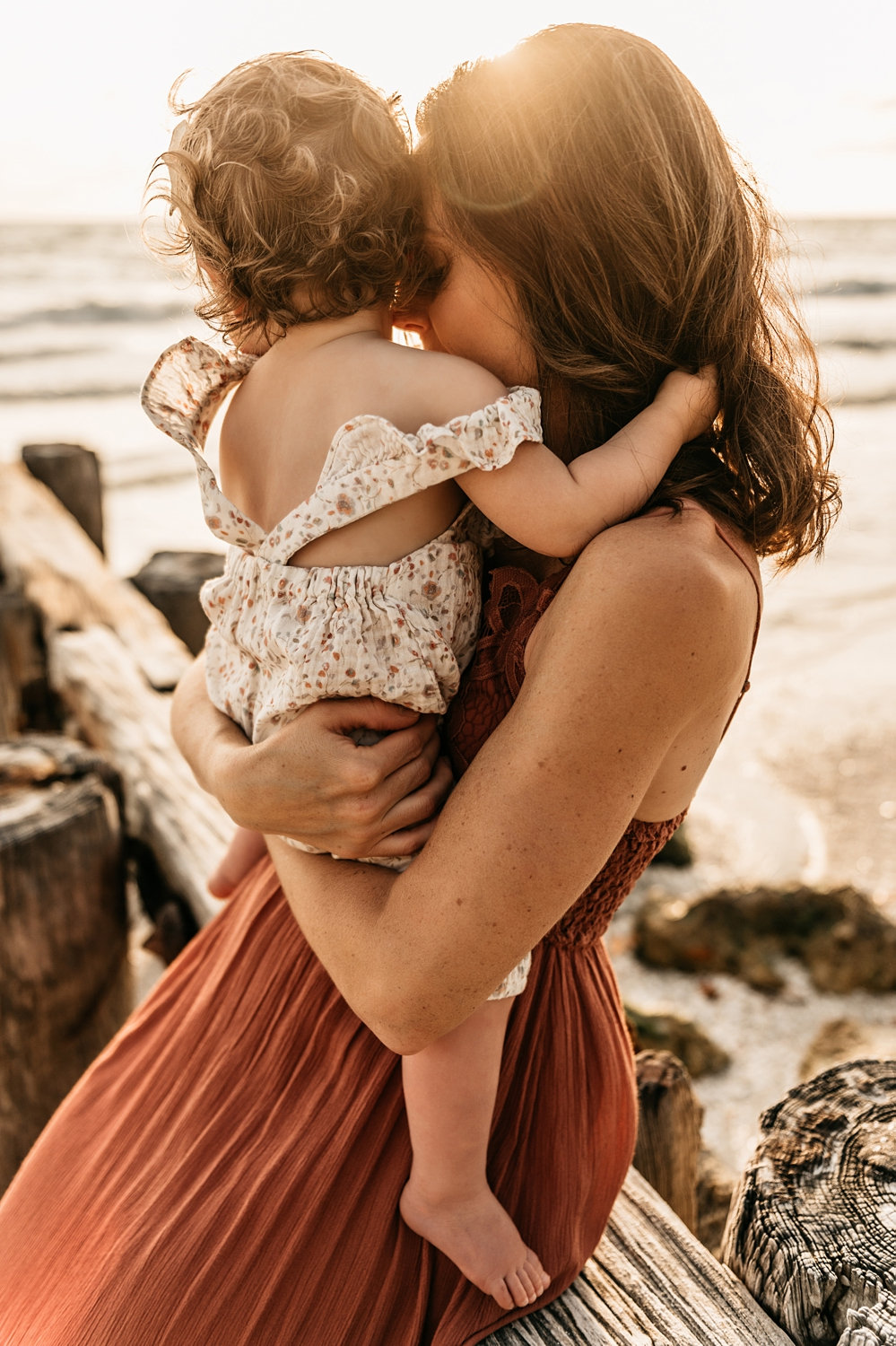 mother nuzzling baby girl, sunset beach photo session, Ryaphotos