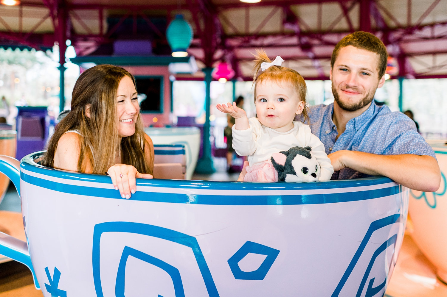 mom and dad with little girl, Disney World teacup ride, Magic Session, Rya Duncklee